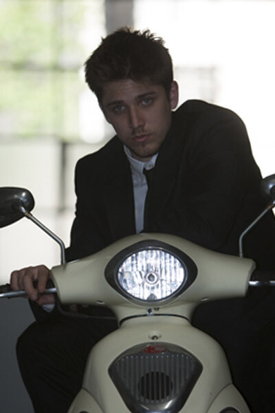 on-camera flash photo of man on a motorcycle